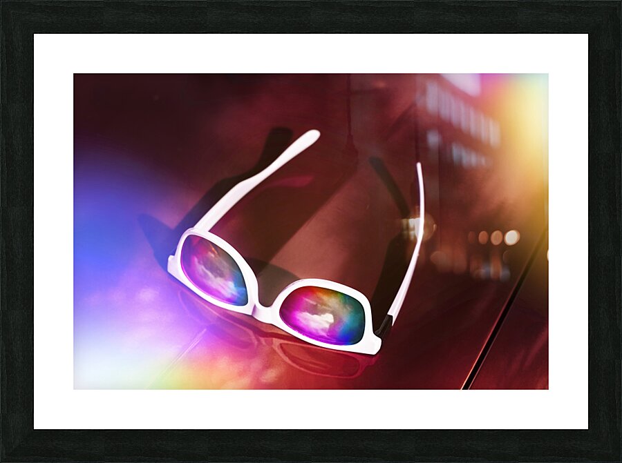 Sunglasses on car bonnet. 1980s road trip Picture Frame print