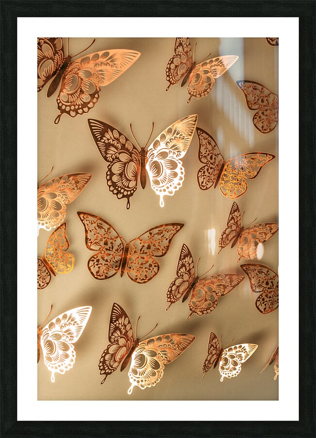 Golden butterflies adorning a soft beige wall Picture Frame print
