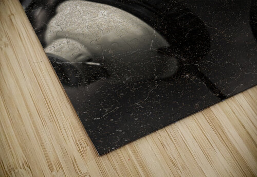 Urban man wearing headphones and beer cap in mouth Jorgo puzzle