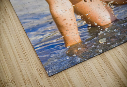 Sensuous woman playing with water Jorgo puzzle