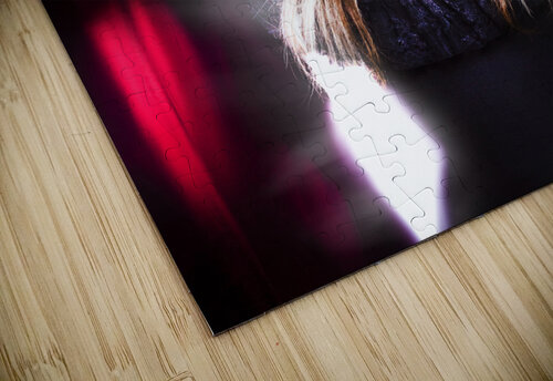 Female performer behind the stage curtain light Jorgo puzzle