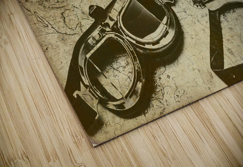 Goggles pouch and model biplane on map Jorgo puzzle