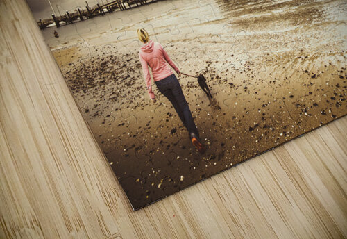 Woman walking dog on stormy beach Jorgo puzzle