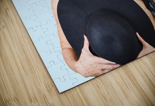 Woman posing with hat Jorgo puzzle