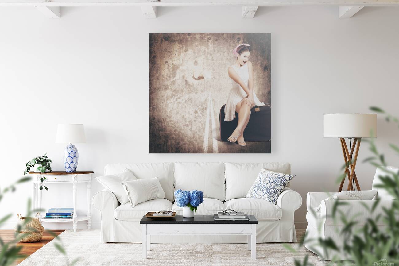 Young hitchhiking pin-up woman on vintage suitcase Reproduction