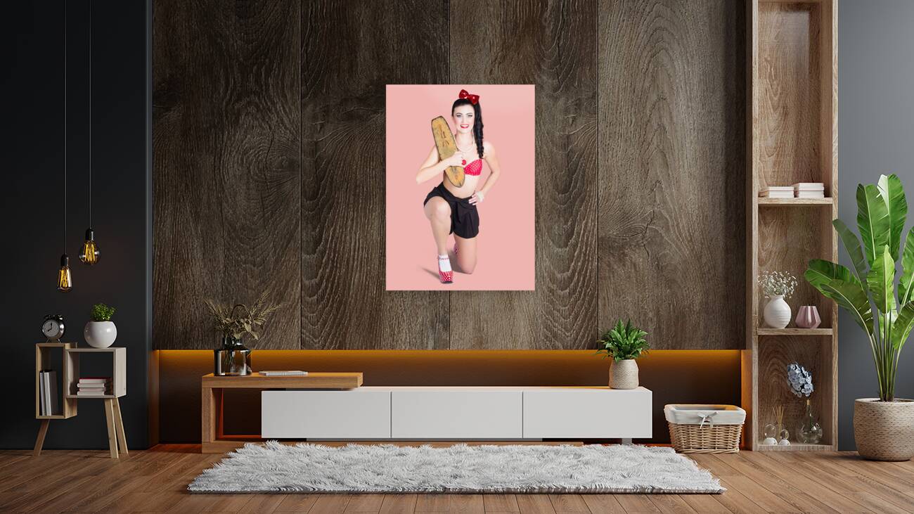 A pin up girl holding a little wooden skateboard Reproduction