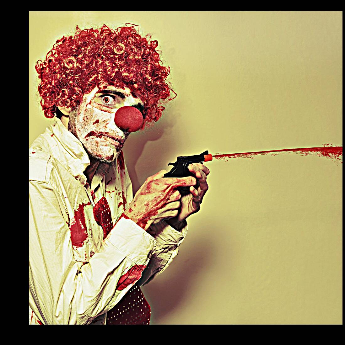Creepy Manic Clown Shooting Blood From Cap Gun Reproduction