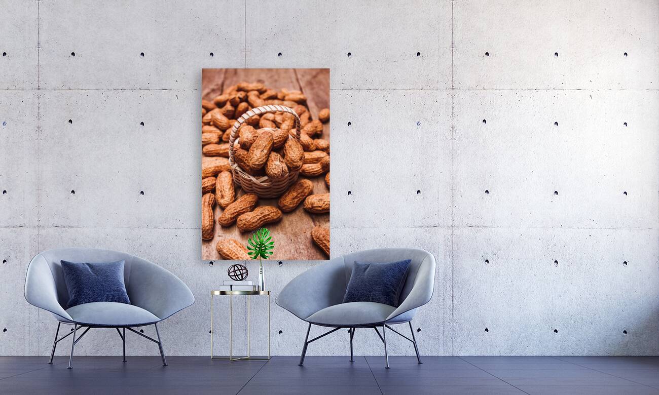 Peanuts in tiny basket in close-up Reproduction