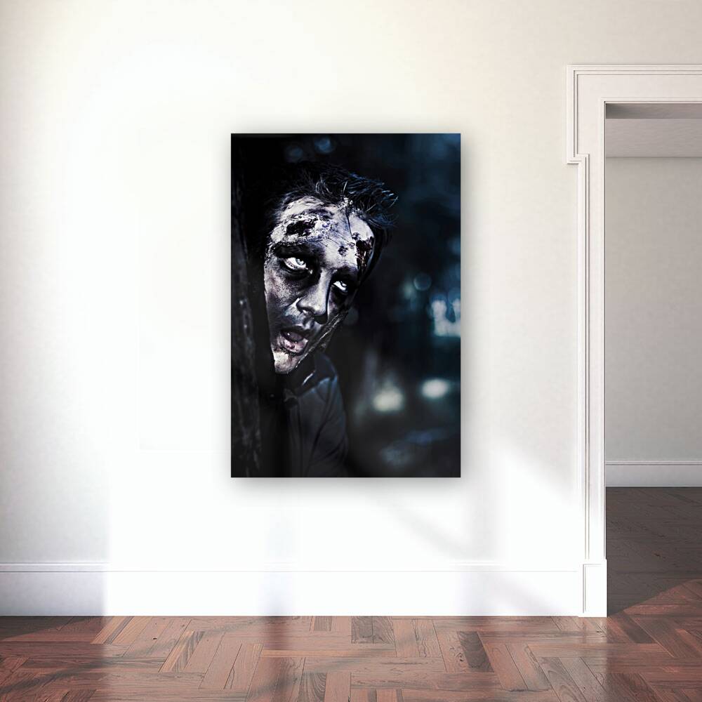 Head of a scary zombie peeking from behind tree Reproduction