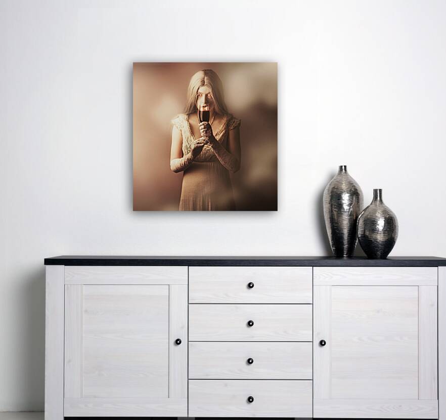 Gothic woman slipping wine glass. Halloween party Reproduction