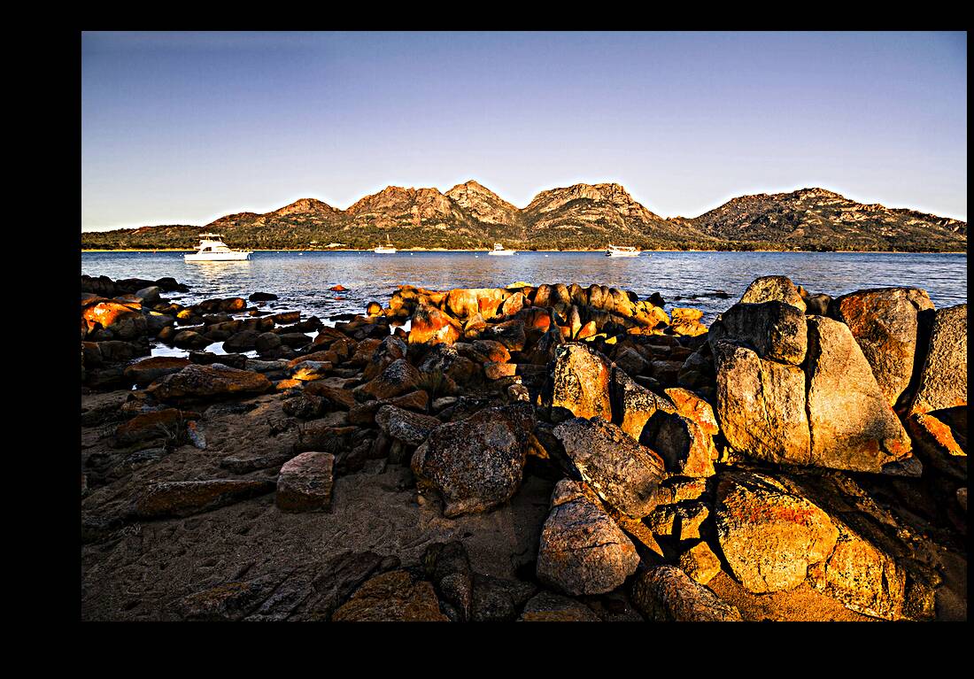 Golden rocky beachfront Reproduction