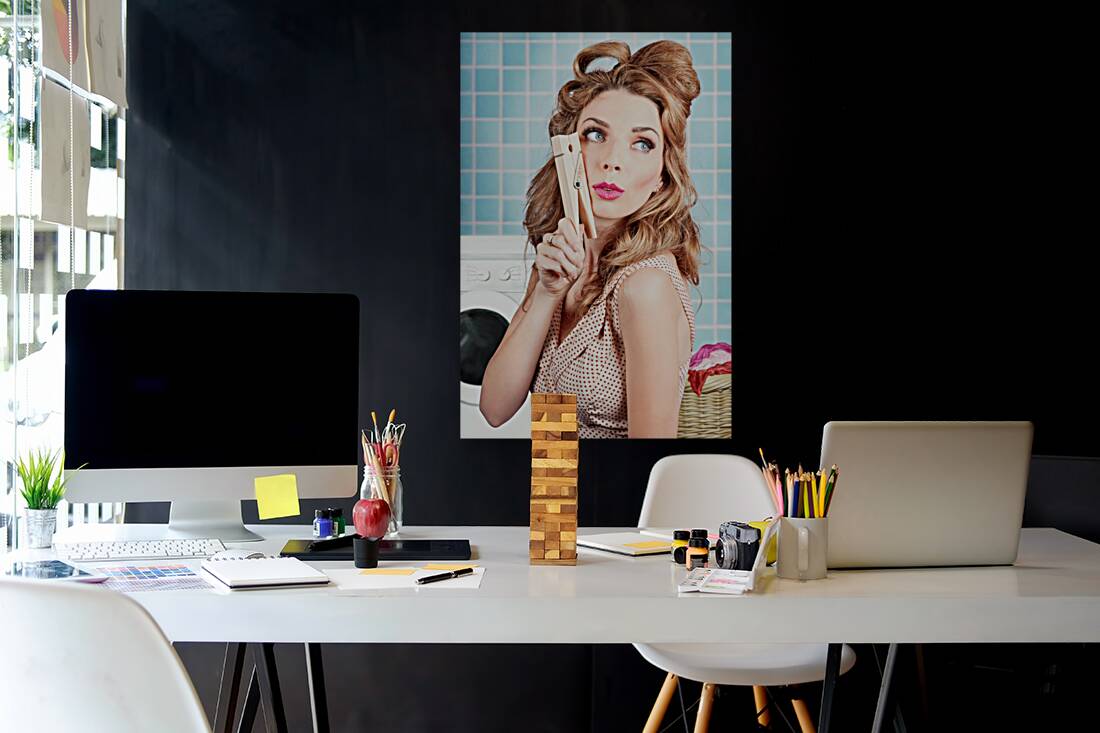 Gorgeous pin-up woman holding large cleaning peg Reproduction