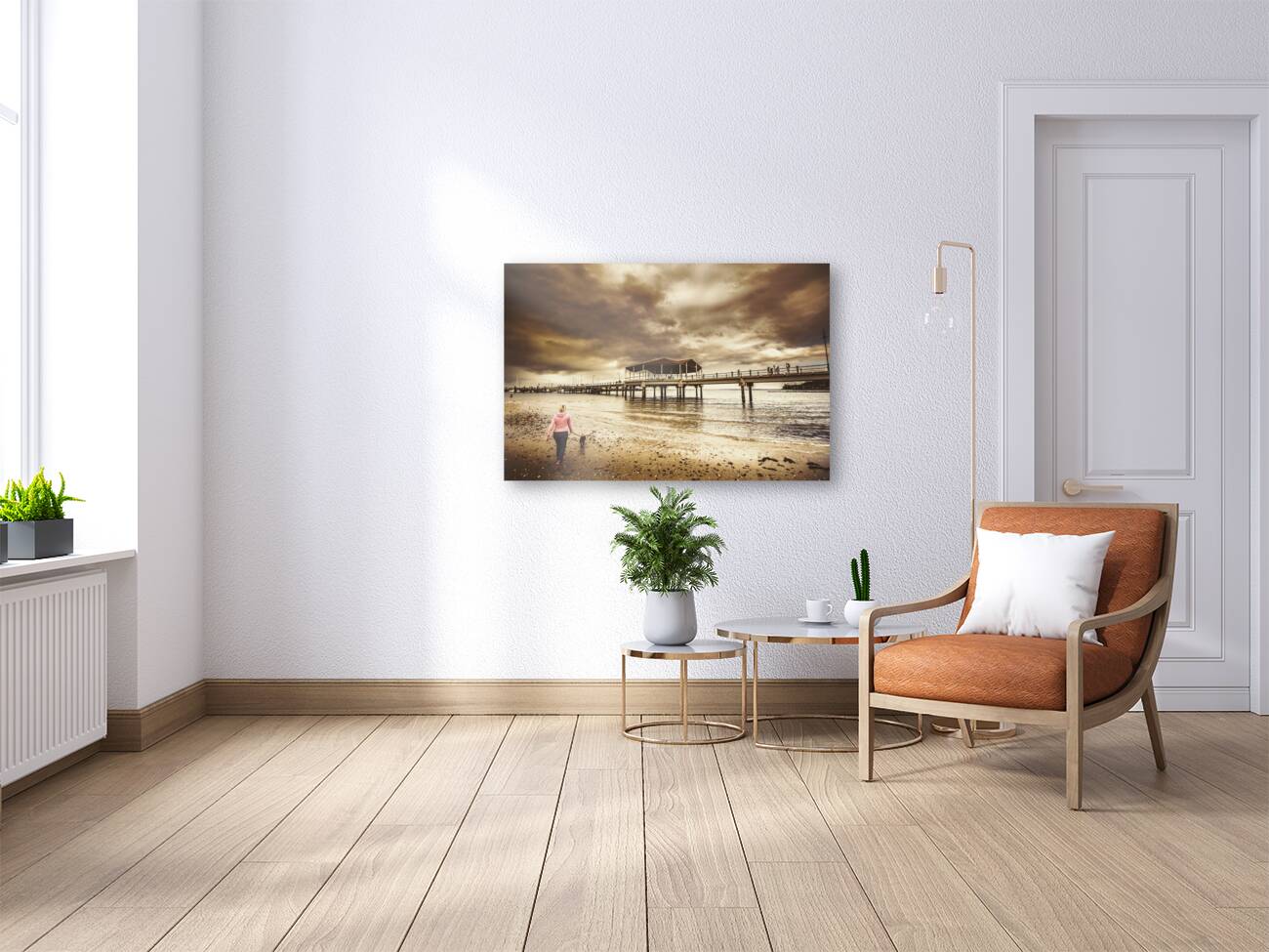 Woman walking dog on stormy beach Reproduction