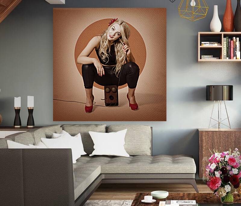 Happy pin up girl talking on retro box telephone Reproduction