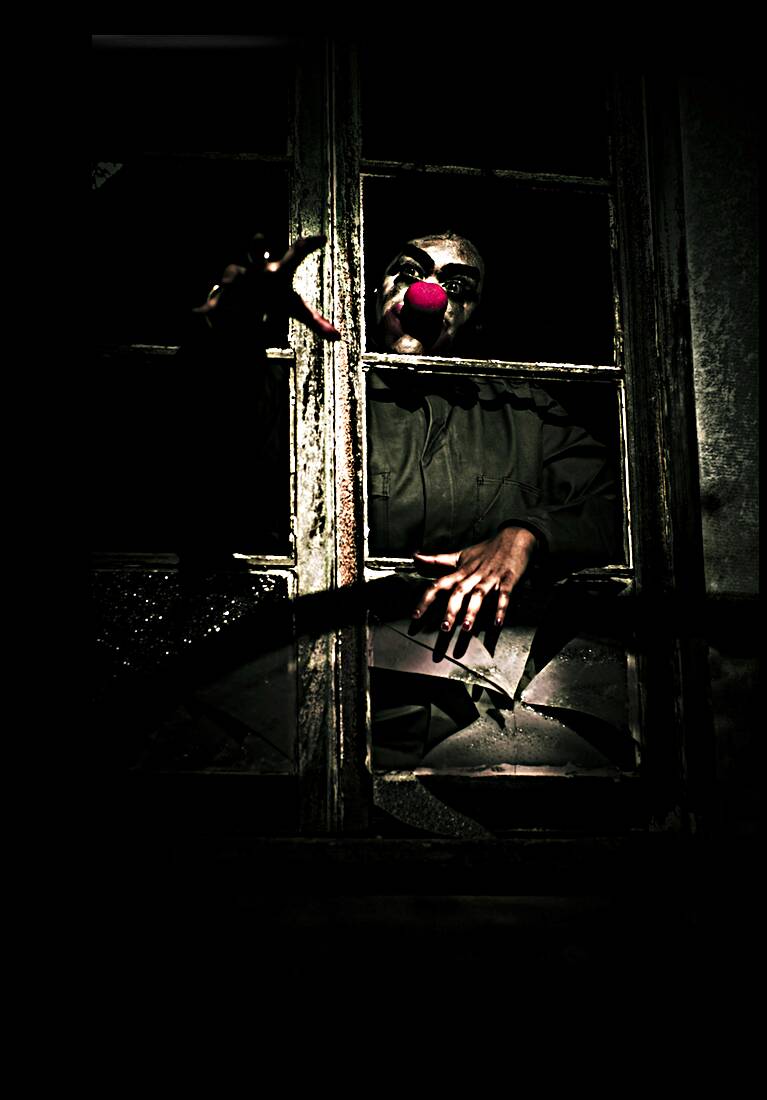 Scary Clown Clawing Window Reproduction