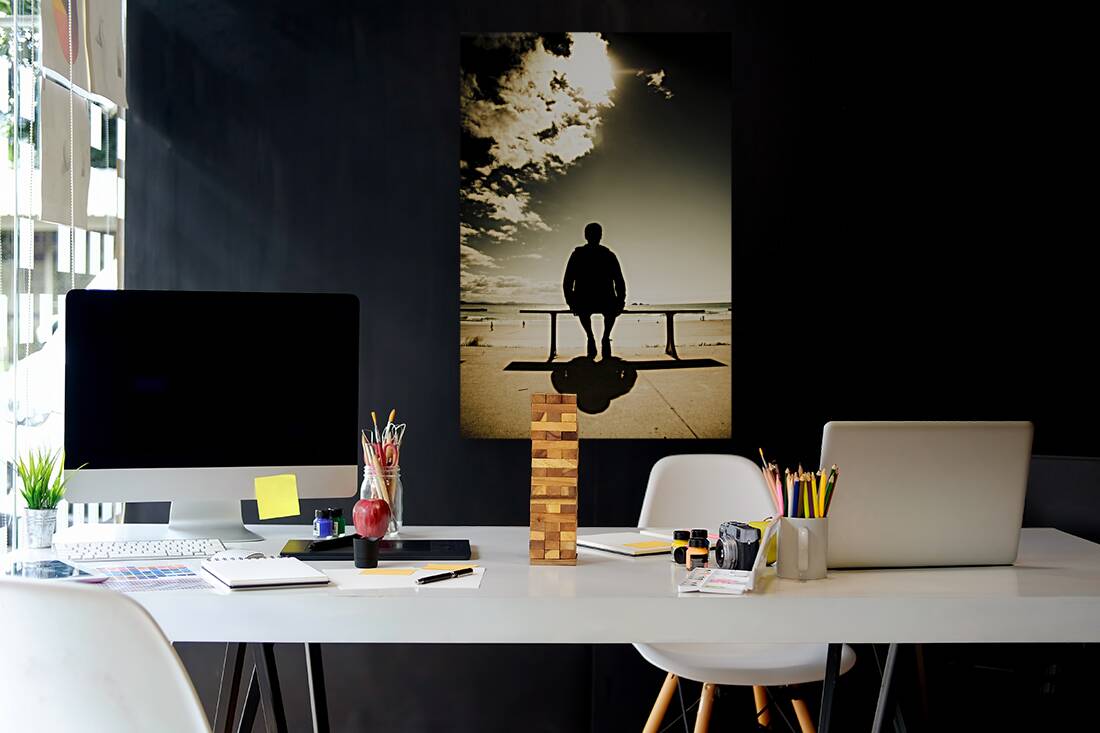 Young Man In Silhouette Sitting In The Sun Reproduction