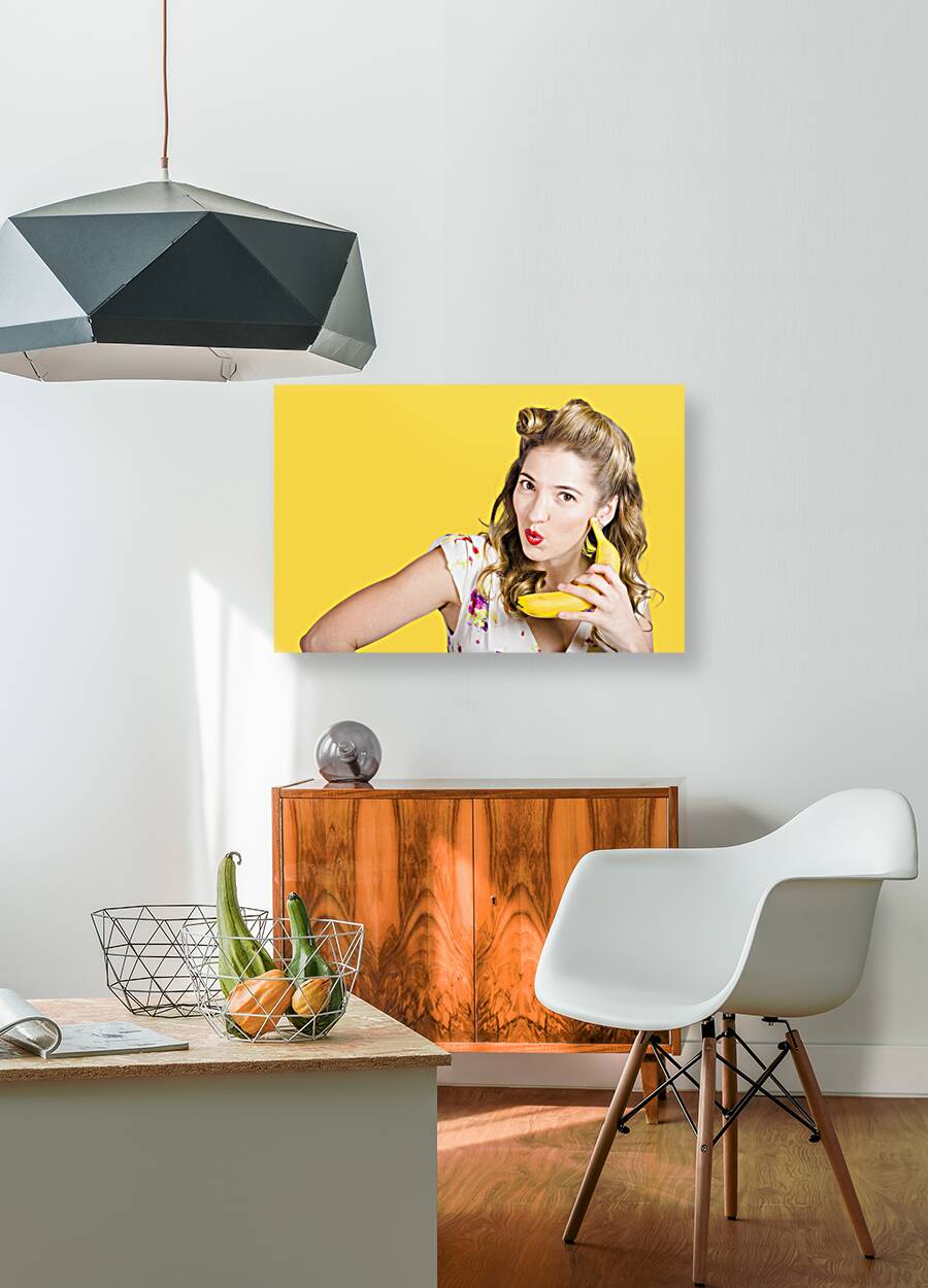 Pinup woman ordering organic fruit on banana phone Reproduction