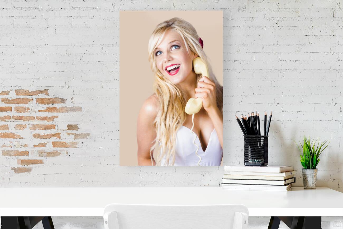 Gorgeous blond woman laughing on telephone call Reproduction