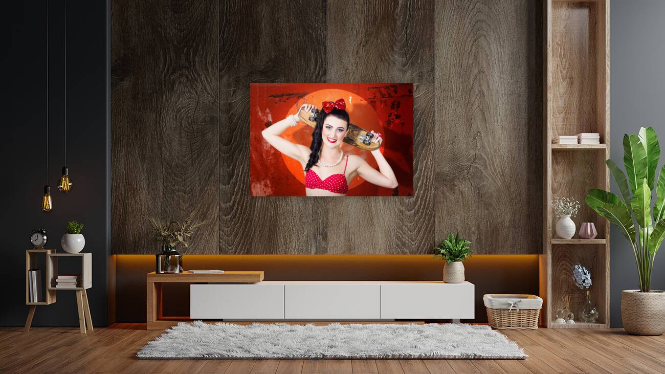 Retro pinup girl holding old wooden skateboard Reproduction