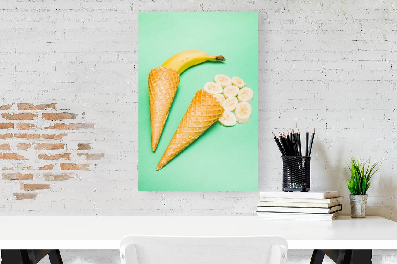 Whole bannana and slices placed in ice cream cone Reproduction