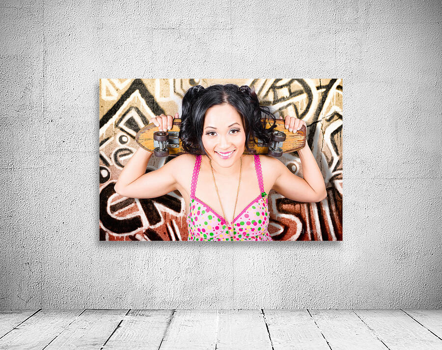 Beautiful skater woman resting against grunge wall Wall Preview