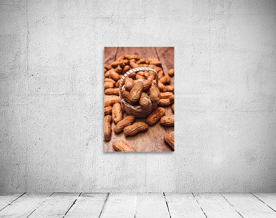 Peanuts in tiny basket in close-up Wall Preview