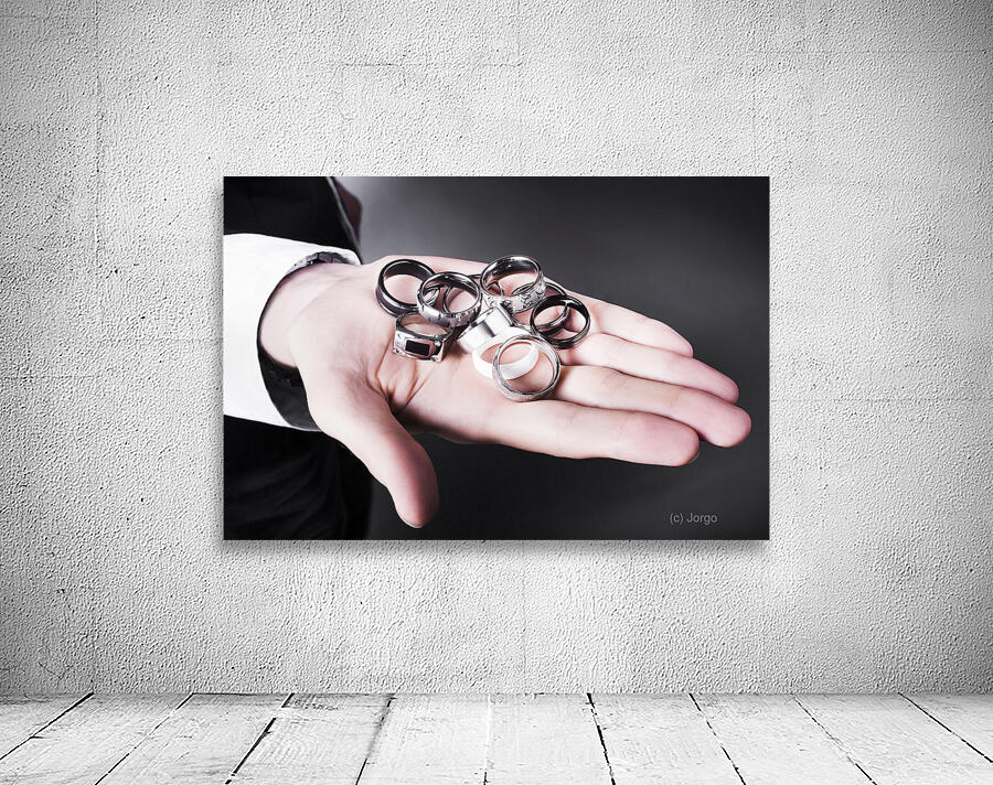 Man displaying a selection of stylish rings Wall Preview