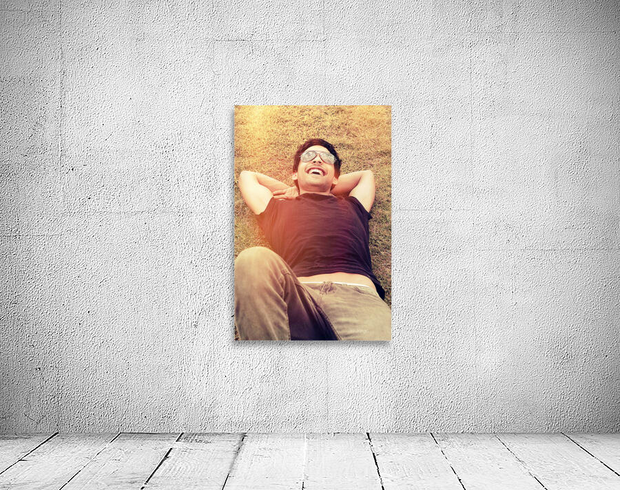 Happy man laughing while enjoying summer holidays Wall Preview