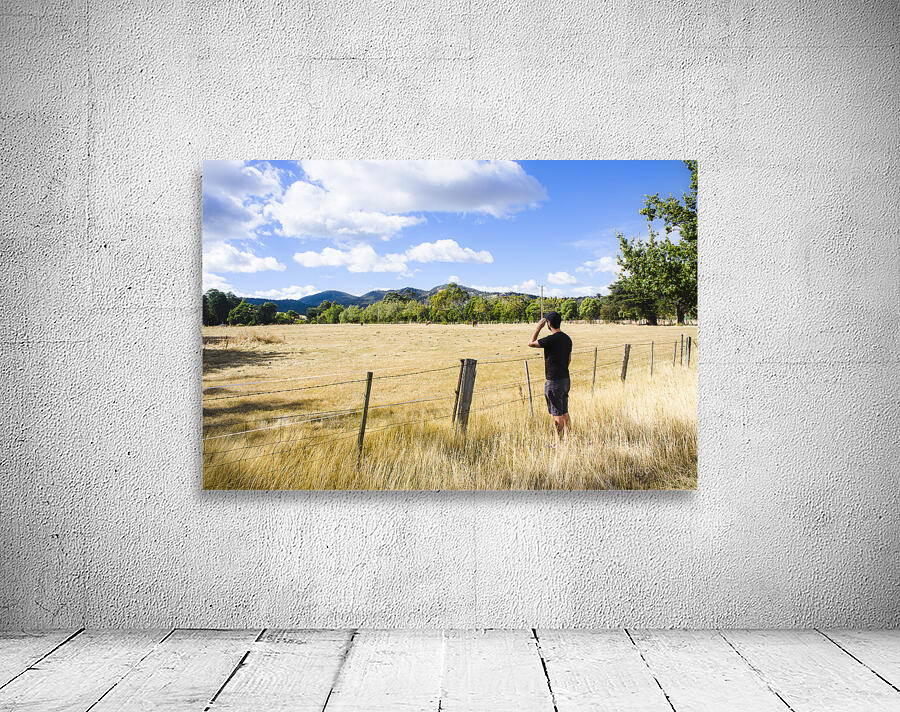 Man enjoying a rural farm landscape in Hobart Wall Preview