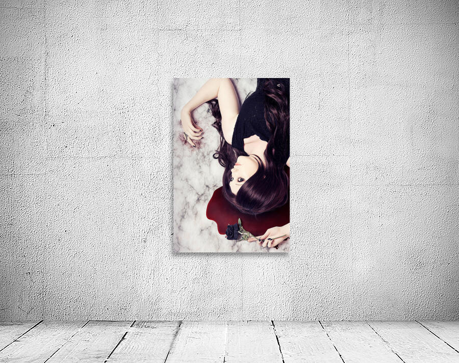 Dead woman holding black flower in blood puddle Wall Preview