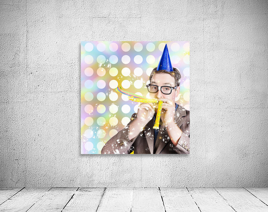 Amusement man in party hat celebrating a birthday bash Wall Preview