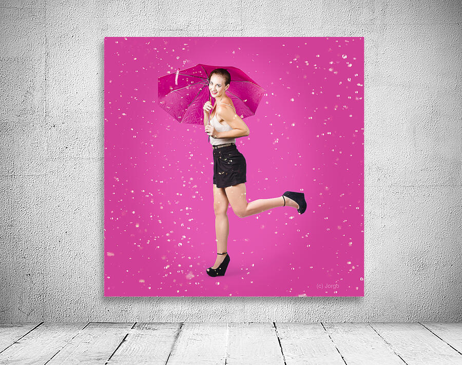 Smiling female model dancing in falling rain Wall Preview