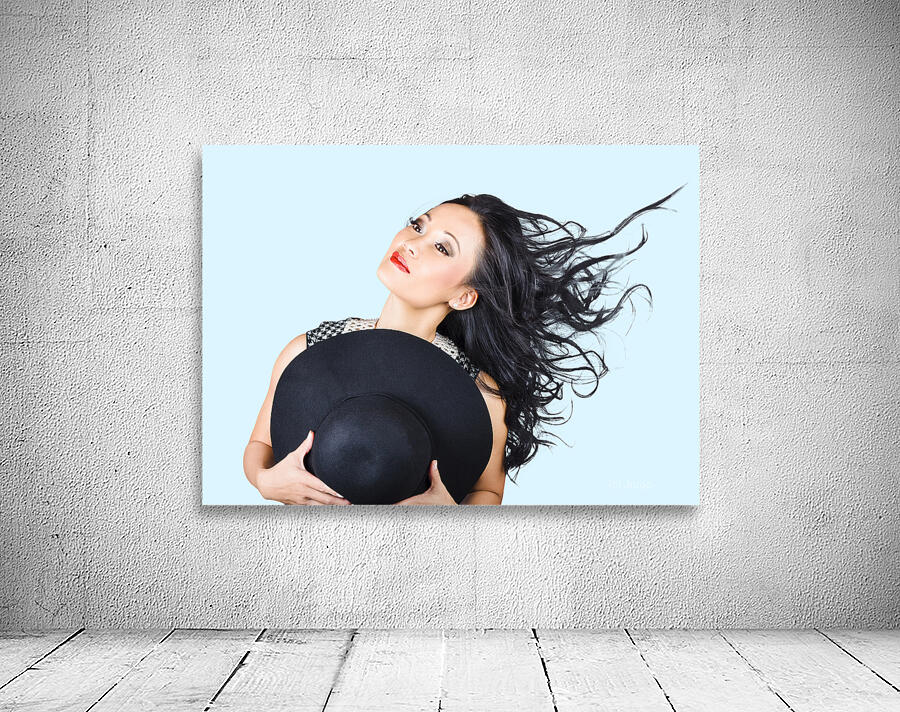 Woman posing with hat Wall Preview