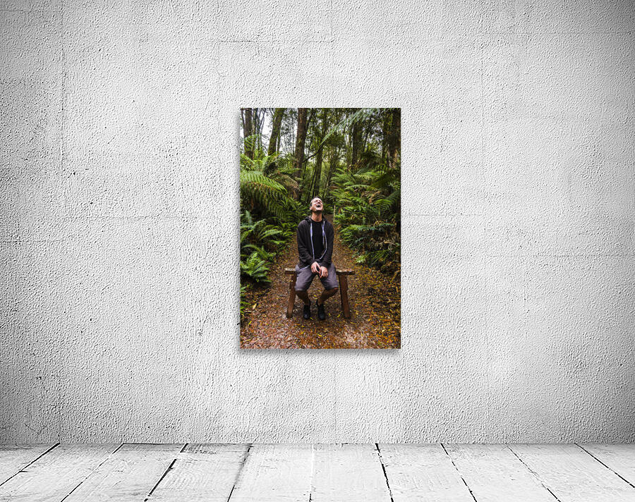 Travel man laughing in Tasmania rainforest Wall Preview