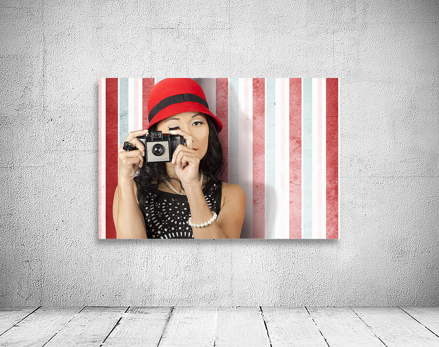 Pin-up photographer in 40s fashion holding camera Wall Preview