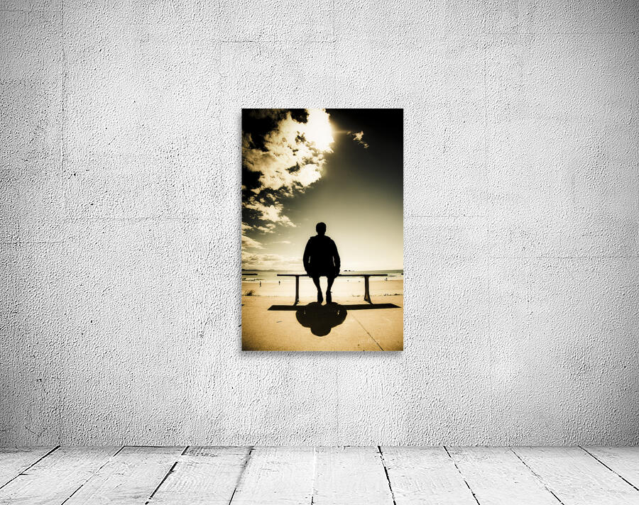 Young Man In Silhouette Sitting In The Sun Wall Preview