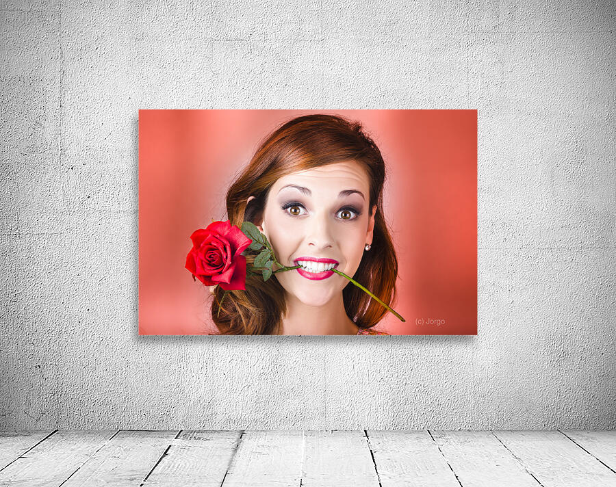 Woman gripping red rose between her teeth Wall Preview