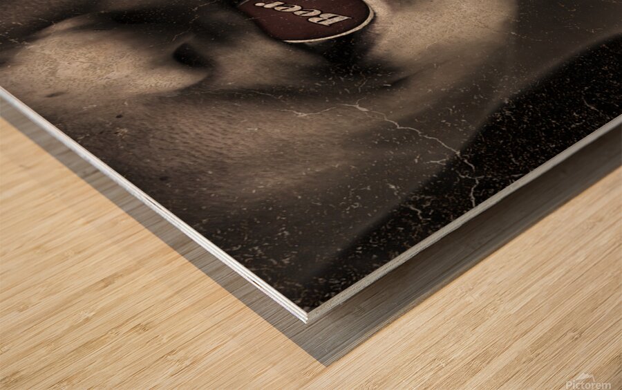 Urban man wearing headphones and beer cap in mouth Wood print