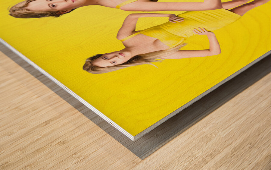 Fashionable girls. Young ladies in summer fashion  Wood print