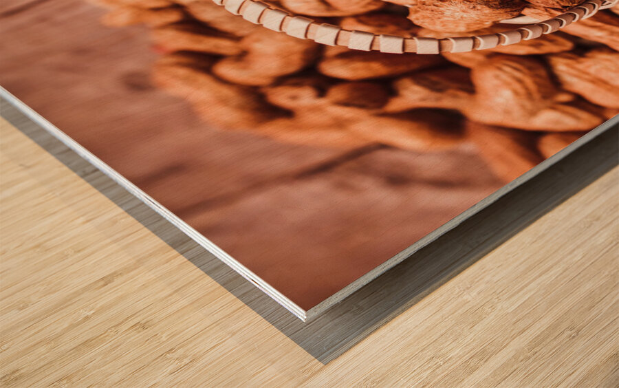 Peanuts in tiny basket in close-up Wood print