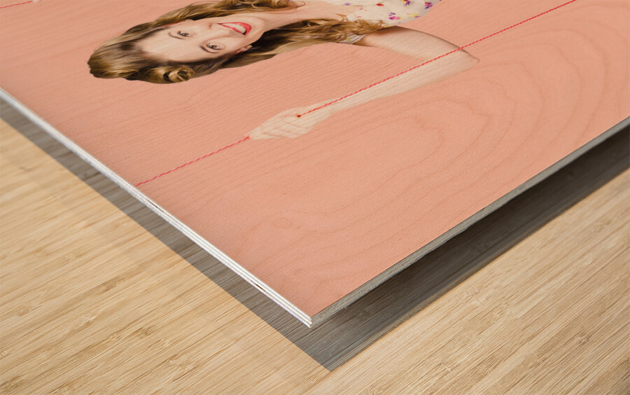 Beautiful fifties pin up girl smiling on swing Wood print