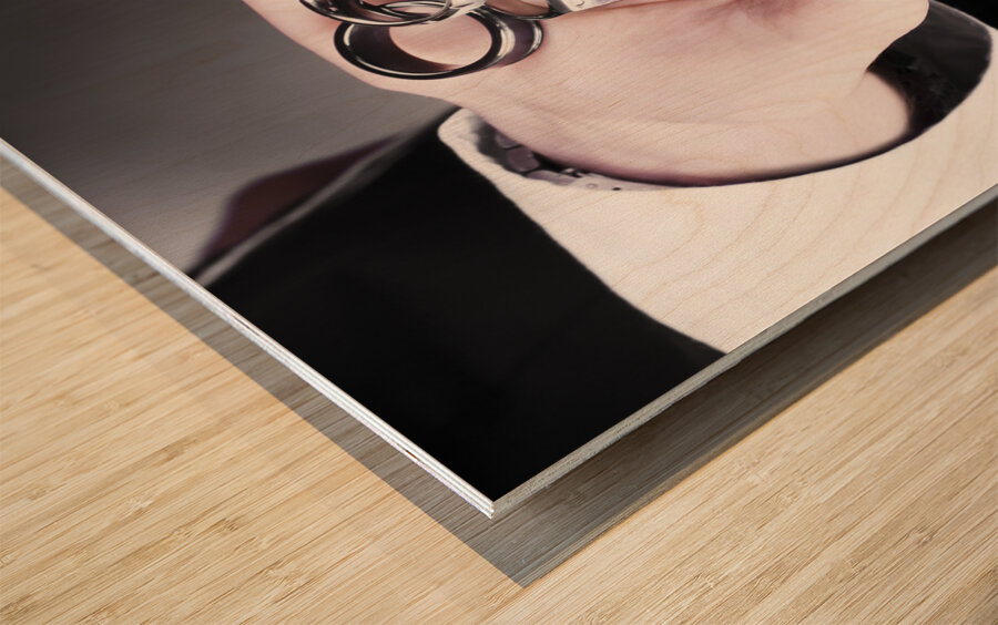 Man displaying a selection of stylish rings Wood print