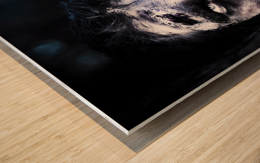 Head of a scary zombie peeking from behind tree Wood print