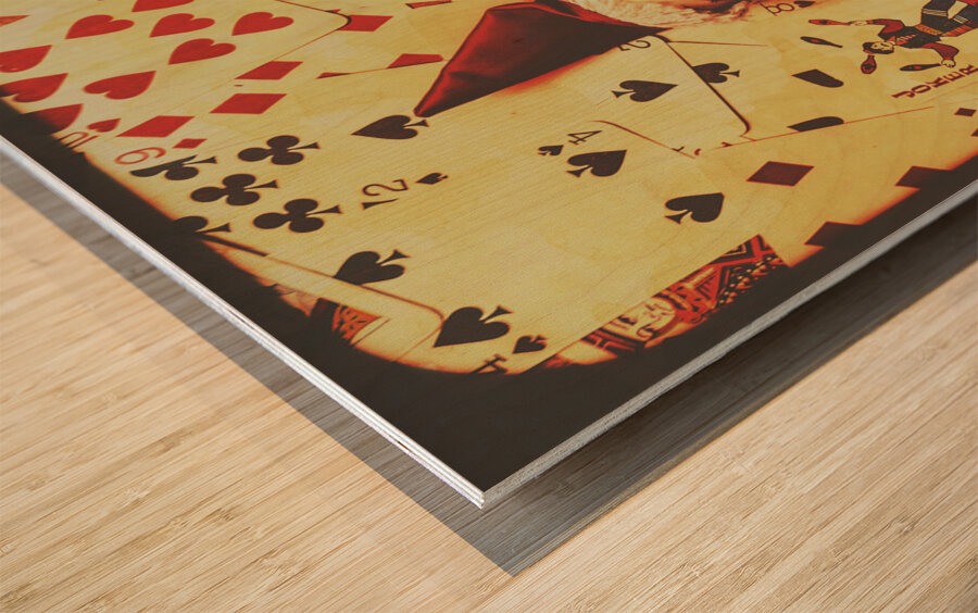 Evil clown doll on playing cards Wood print