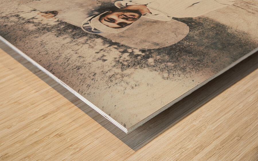 Vintage snowboarding man carrying board in snow Wood print