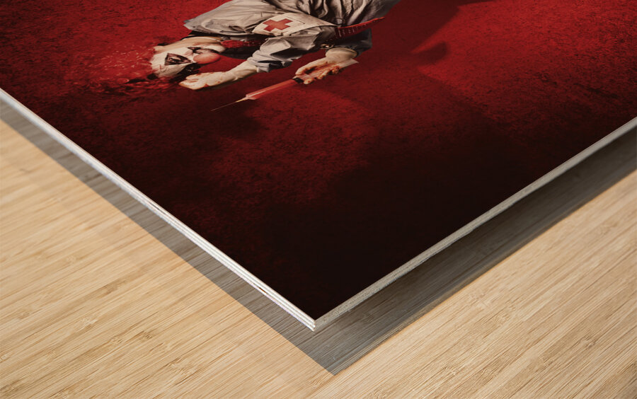 Scary clown doctor about to give jab with syringe Wood print