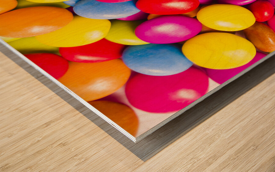 Colourful round candy balls closeup  Wood print
