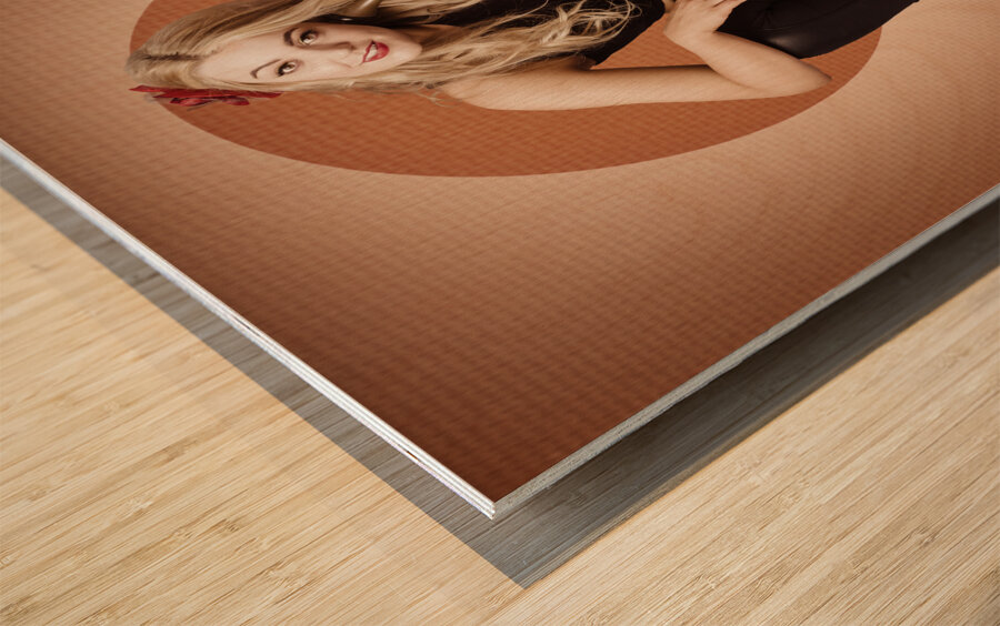 Happy pin up girl talking on retro box telephone Wood print