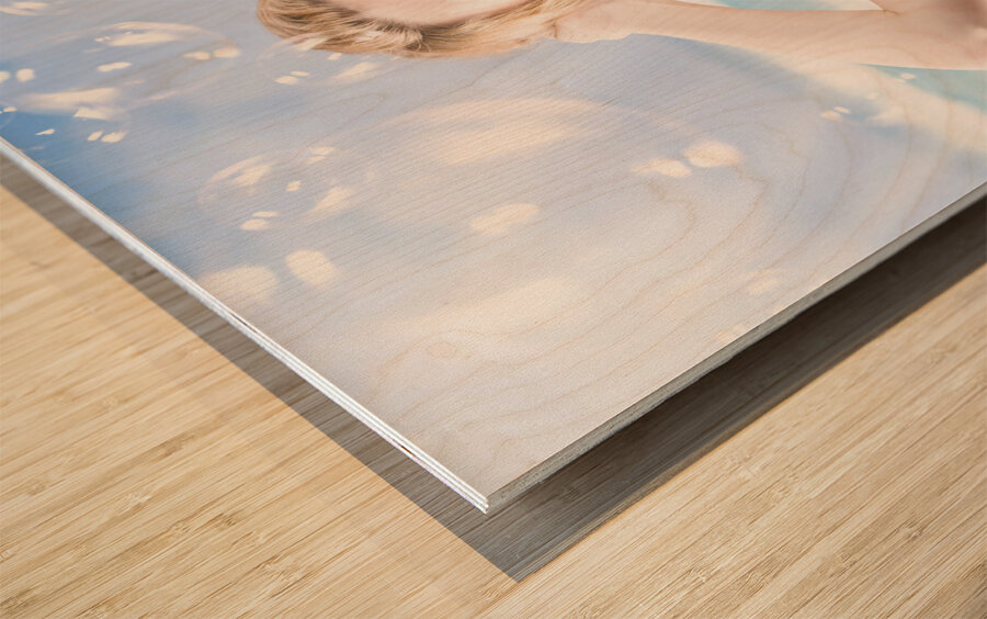 Beautiful girl wearing summer make-up on beach Wood print