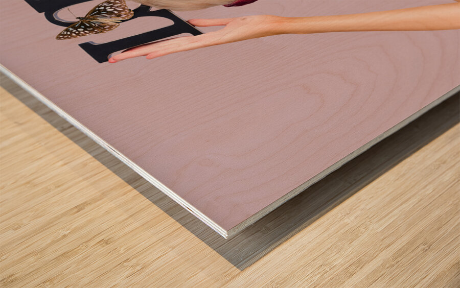 Woman holding love sign Wood print